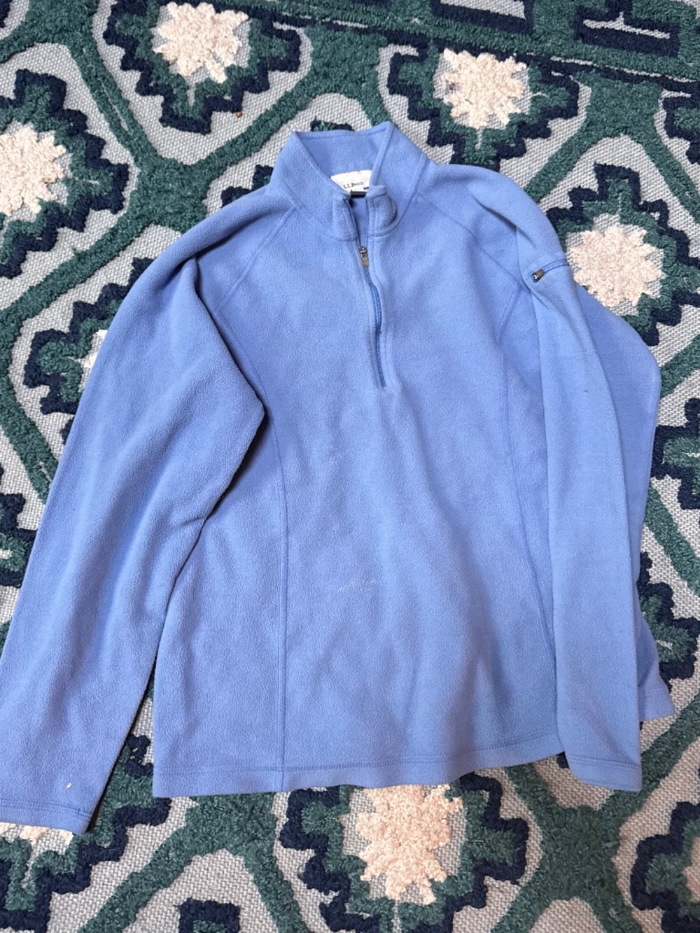blue L.L.Bean women's quarter-zip fleece pullover featuring a zippered pocket on